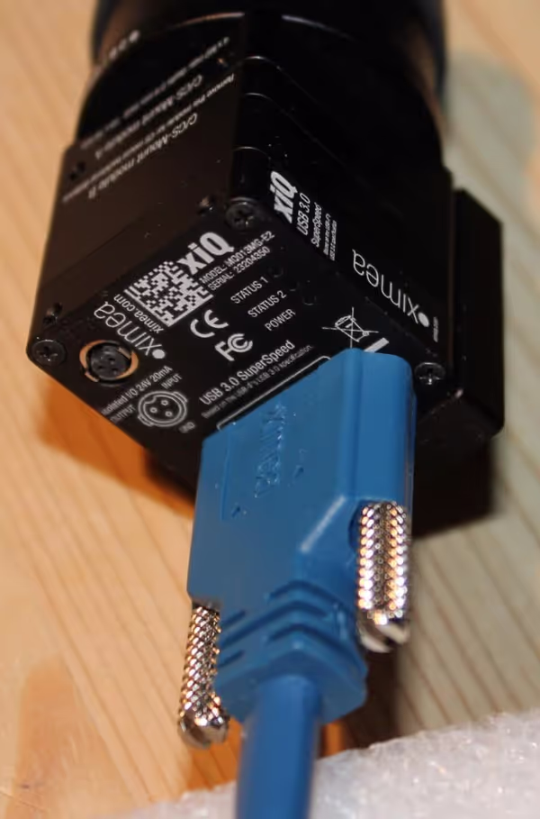 USB3 cable that comes with the camera can be screwed to the camera