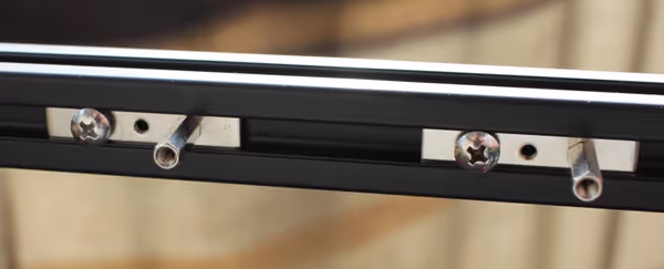 Motherboard standoffs go into the slot and can be positioned as desired