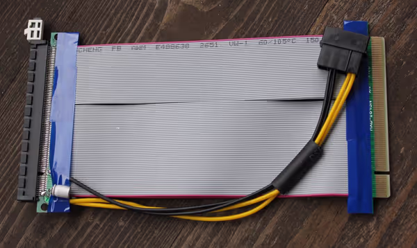 Common gray PCIe riser with required Molex 12V power connector